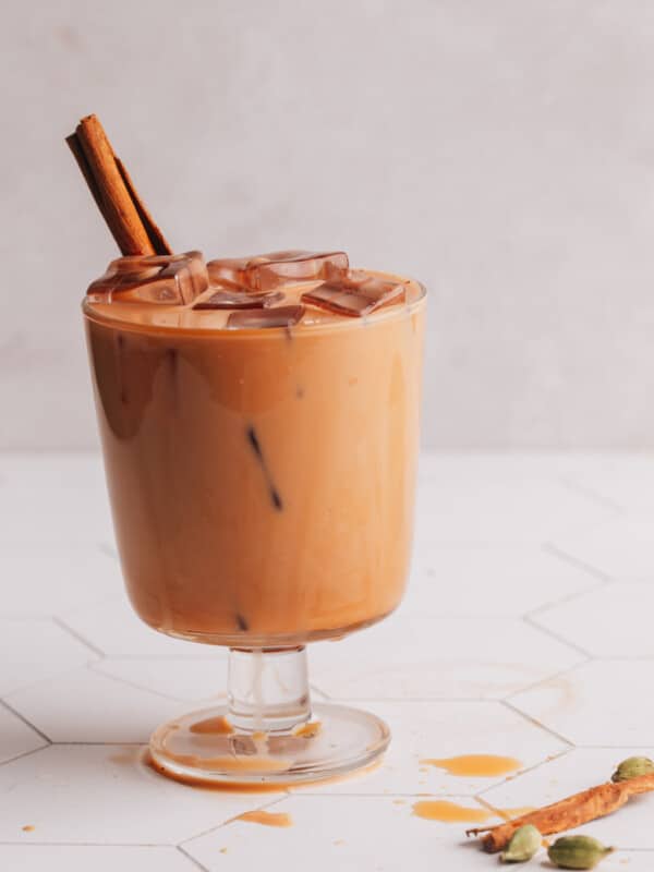 Iced Chai Latte in Glass with cinnamon stick