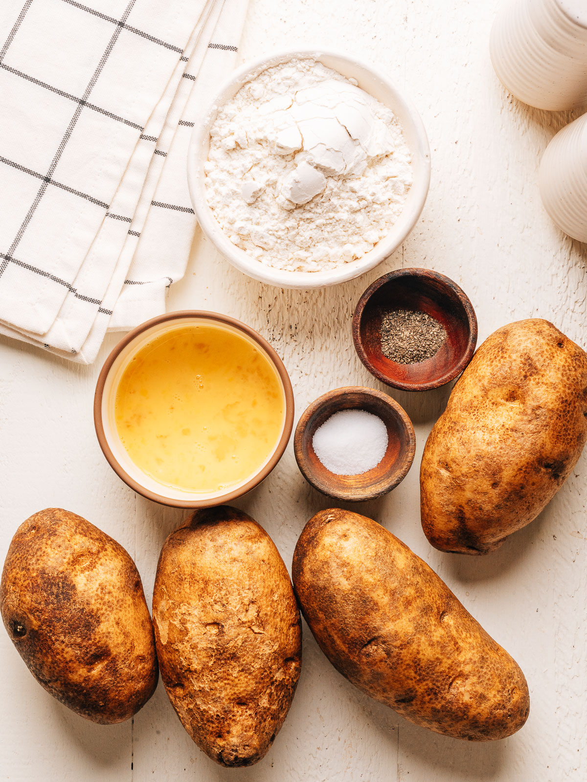Russet potatoes, flour, eggs, salt and pepper for homemade potato gnocchi.