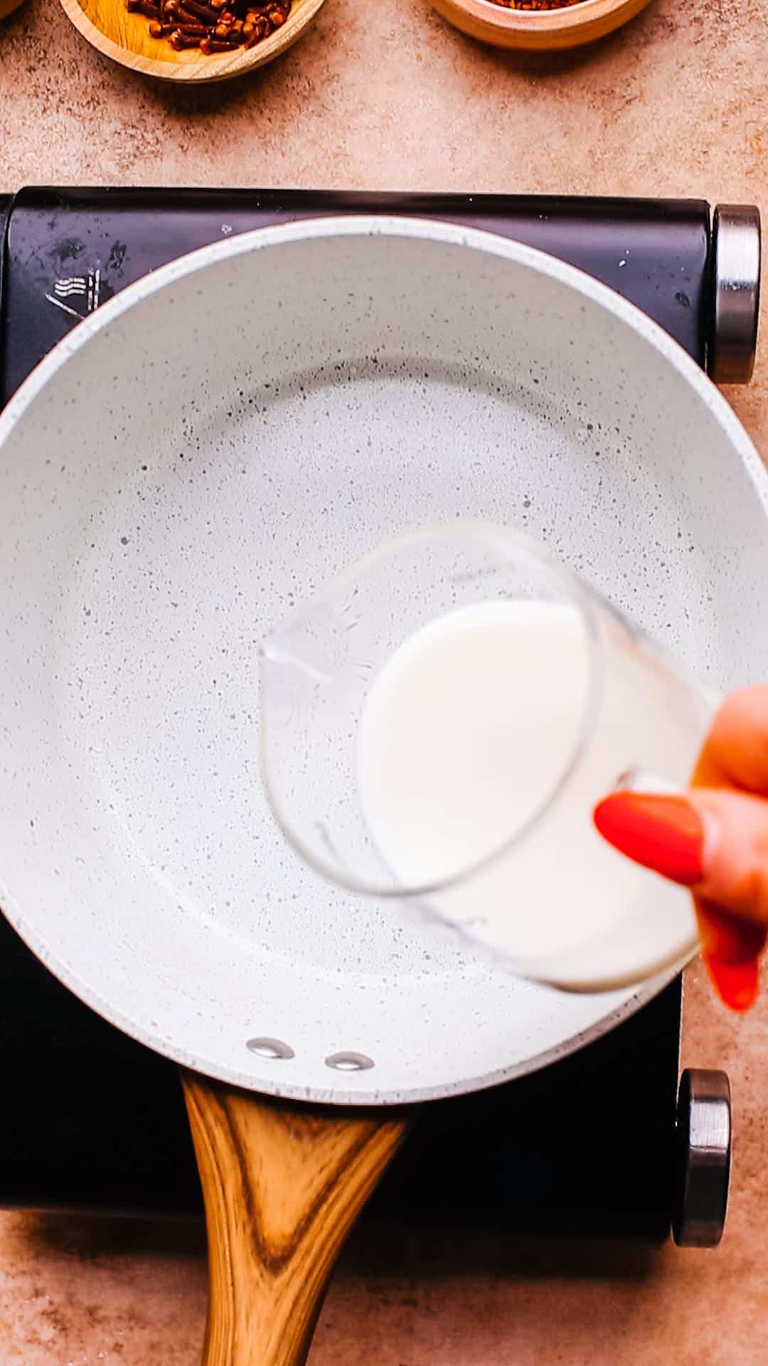Adding milk in pan