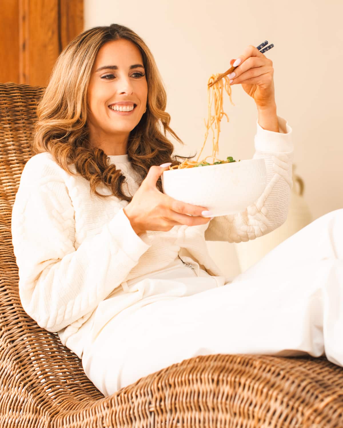 Jennifer Pallian eating a bowl of noodles.