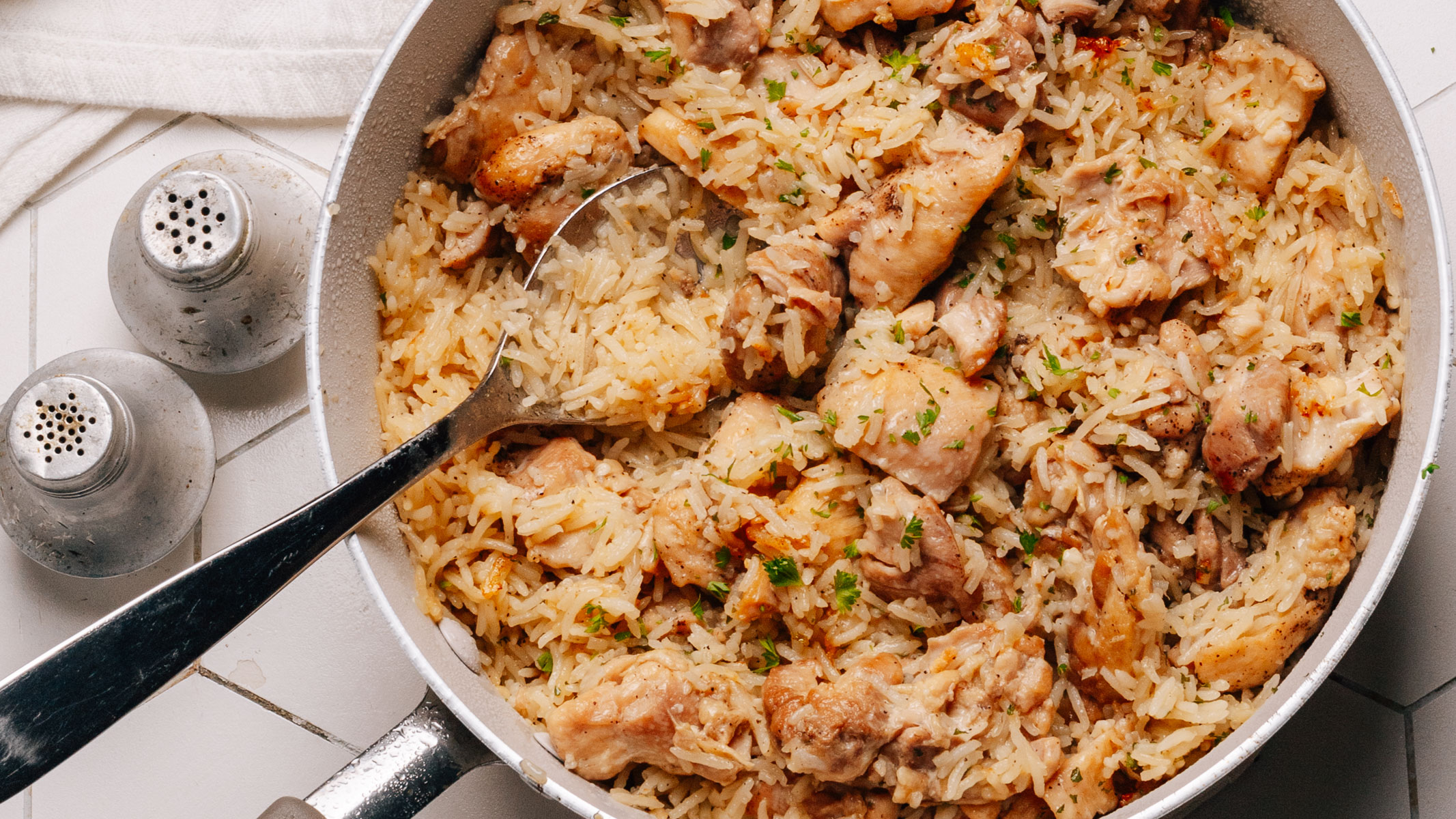 Chicken and rice cooked together in one pan.