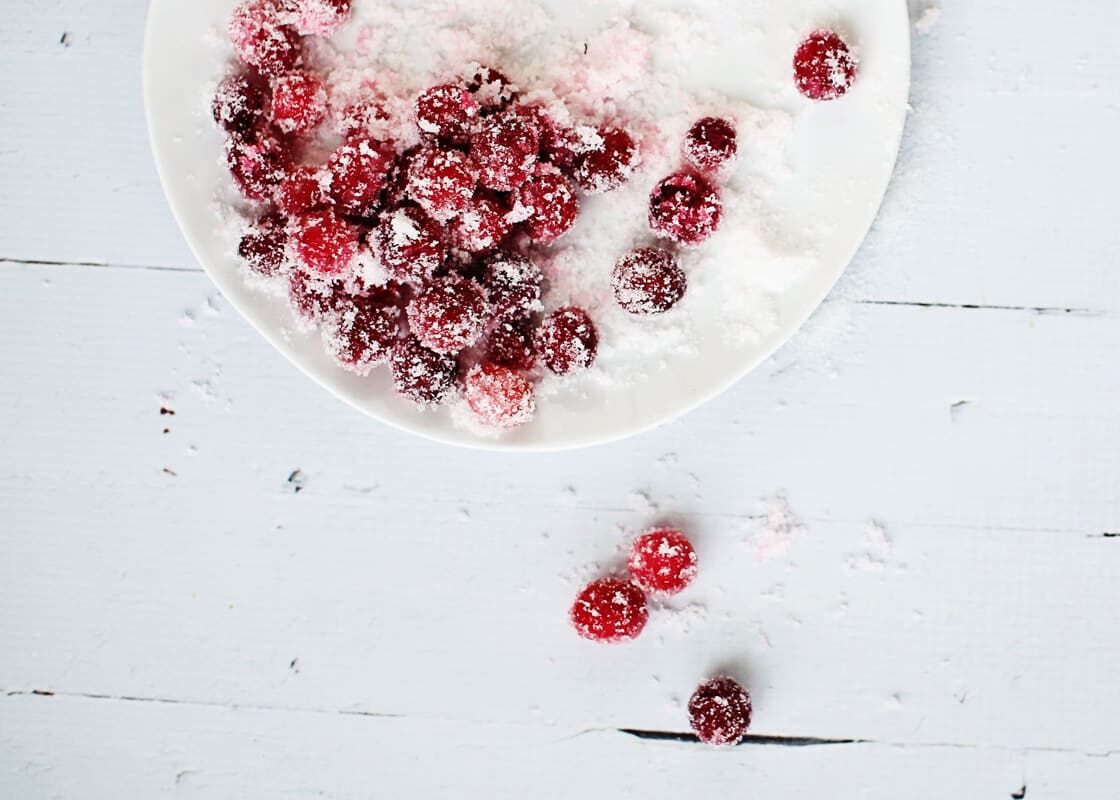 Sugared cranberries on a plate.