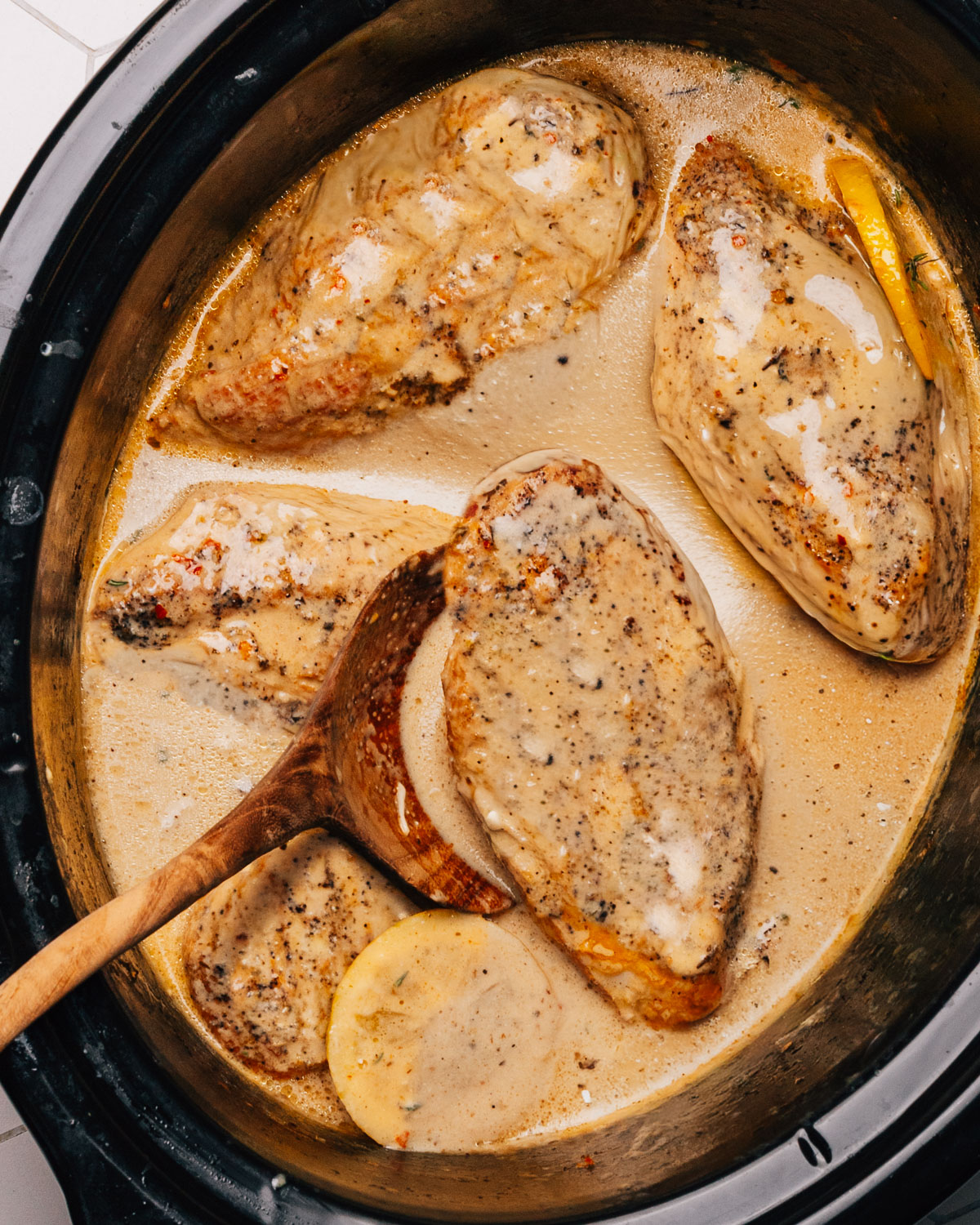 Crock Pot Garlic Parmesan Chicken in the slow cooker crockpot insert.