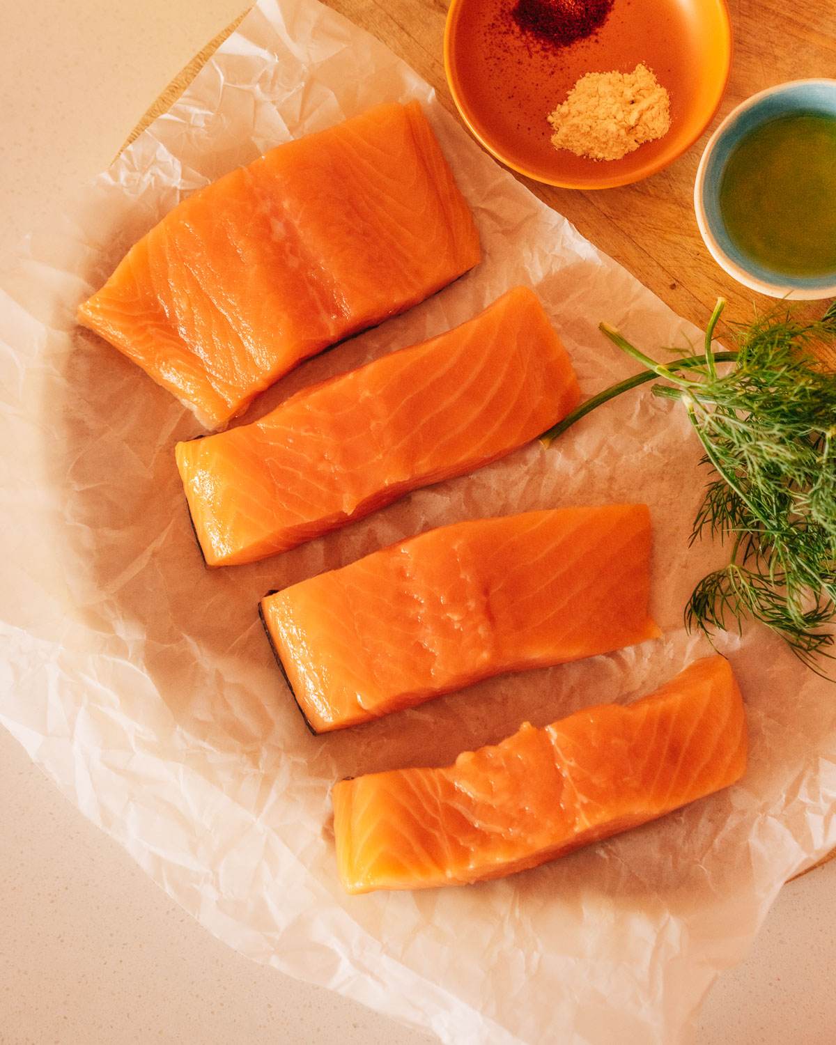 Ingredients for grilled salmon on a counter.
