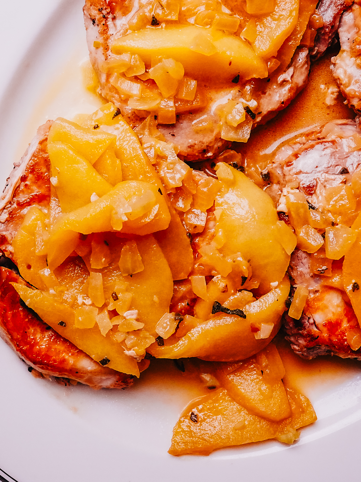 Close-up photo of finished Pork Chops with Apples recipe.