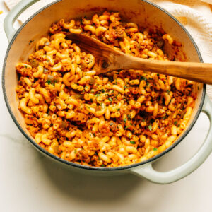 American Goulash recipe in a pot with a spoon.
