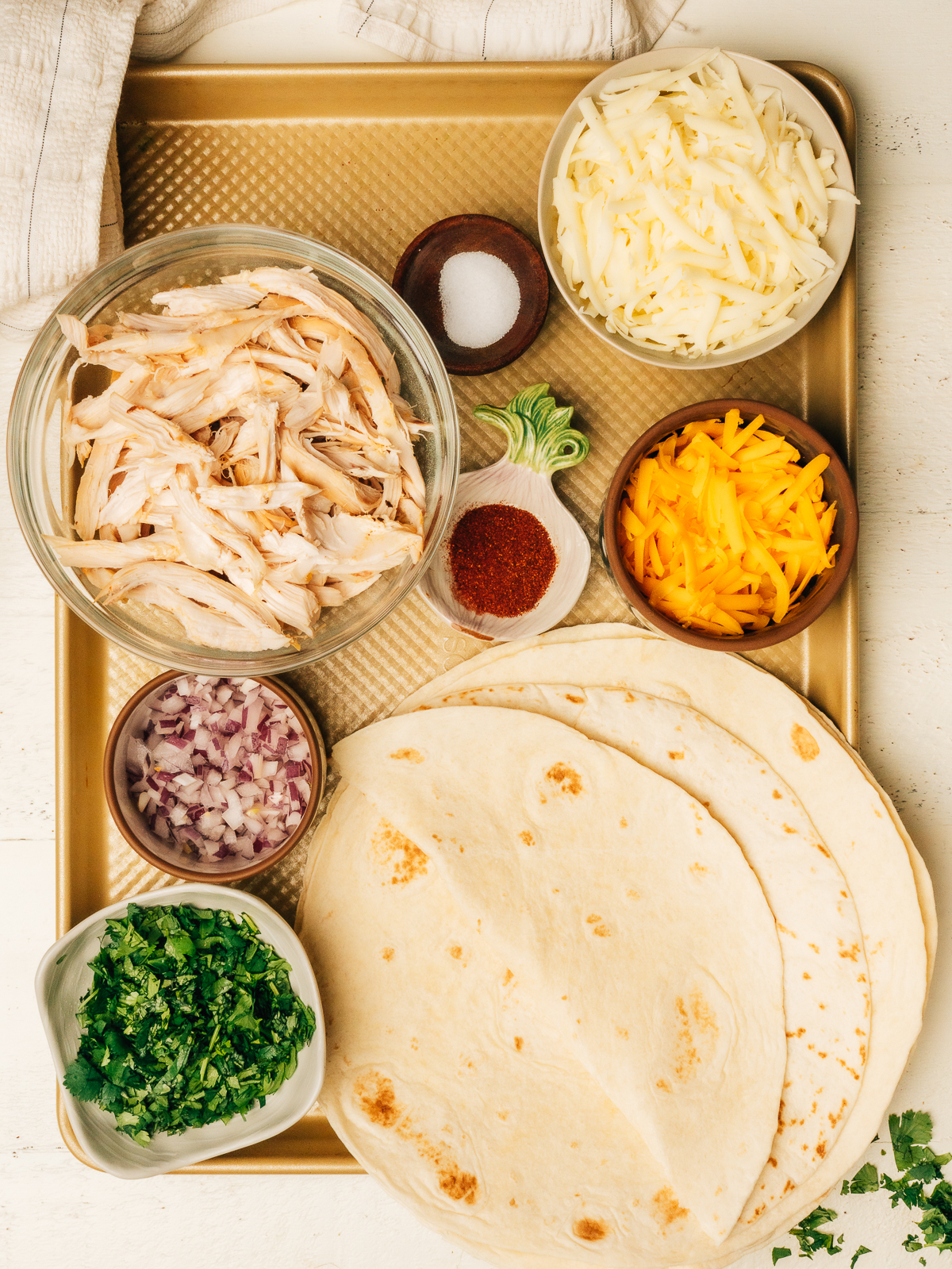chicken quesadilla ingredients laid out on the counter- mise en place style.