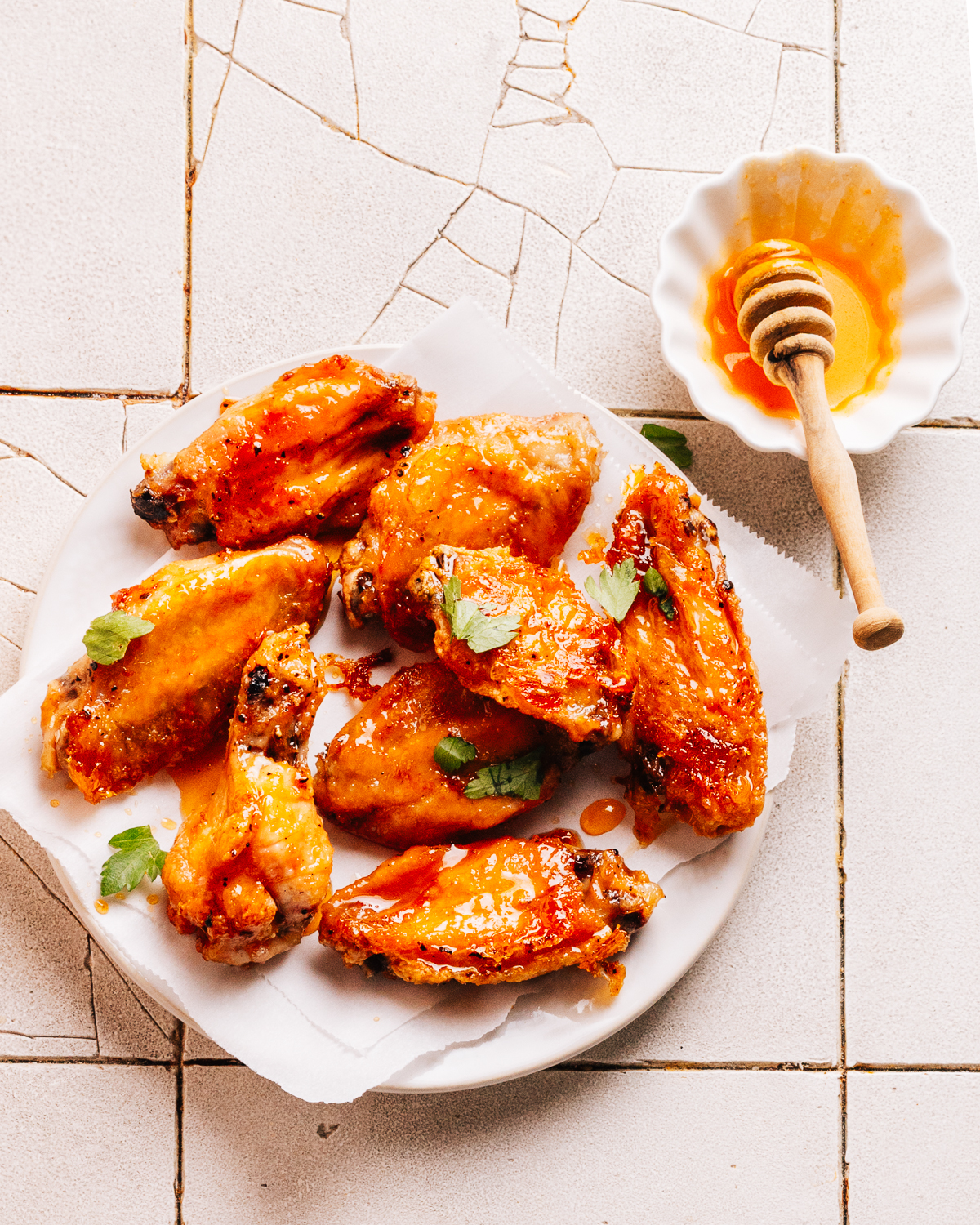 Hot honey wings on a plate.