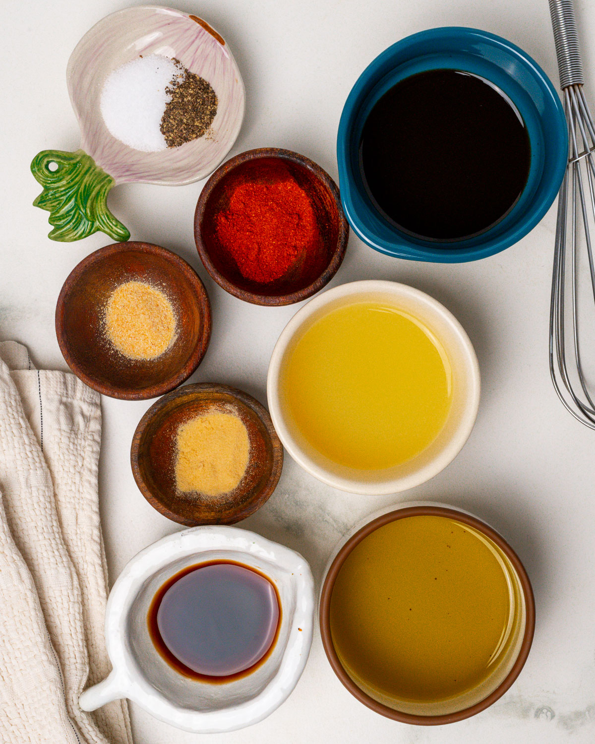 Pork tenderloin marinade ingredients mise en place style (pre-measured) on the counter.