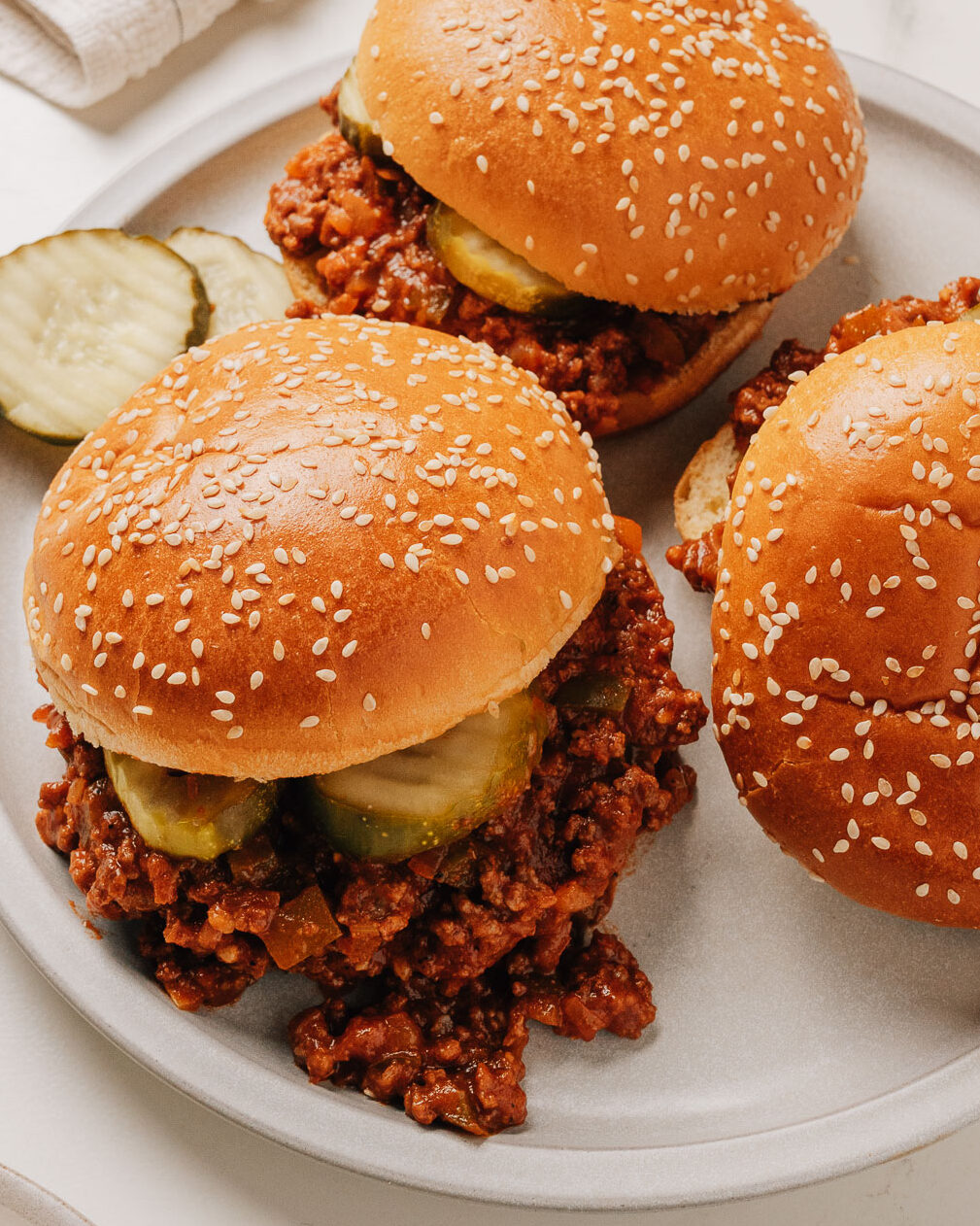 Easy sloppy joes recipe in buns on a plate.