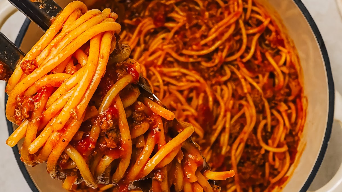 Spaghetti with ground beef recipe ingredients laid out on a counter