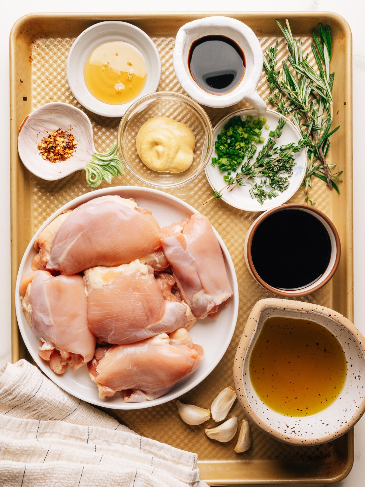 Ingredients for balsamic chicken marinade recipe on a sheet pan. 