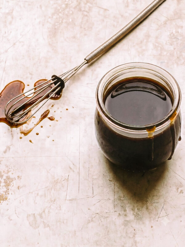 Homemade balsamic vinaigrette dressing in a jar.