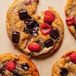 Soft raspberry cookies stacked with jammy fresh raspberries and melted chocolate.