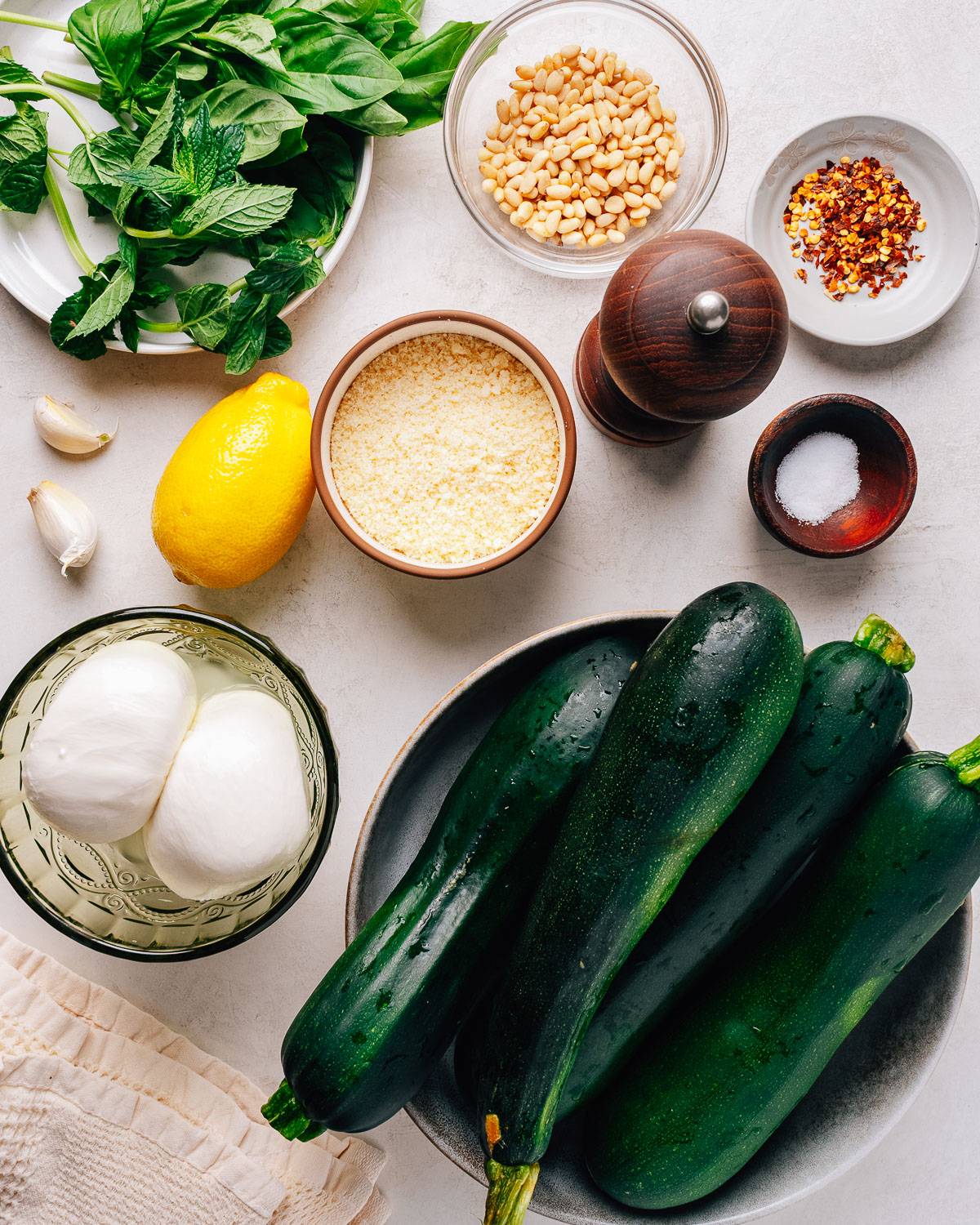 Zucchini salad ingredients on the counter.