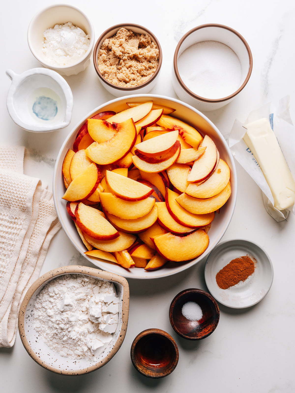 Ingredients for Peach Crumble recipe on the counter.
