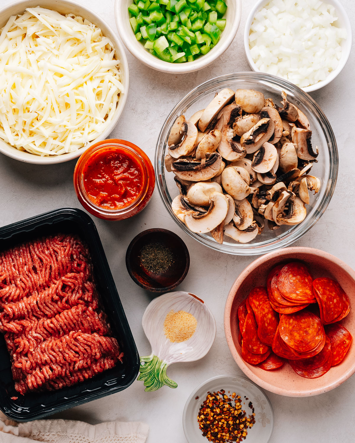 Pizza bowl ingredients on the counter.