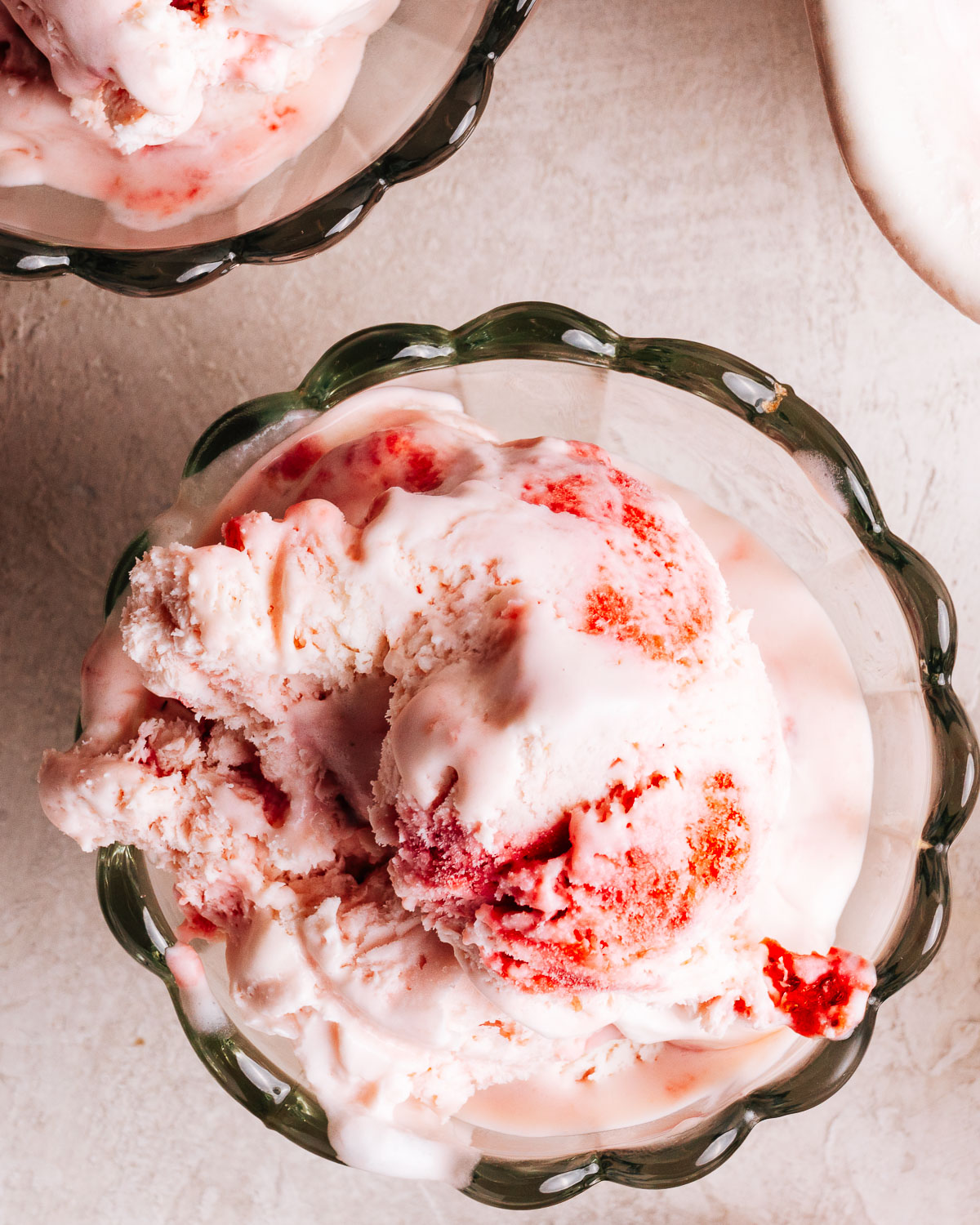 No Churn Strawberry Ice cream recipe scooped into bowls.